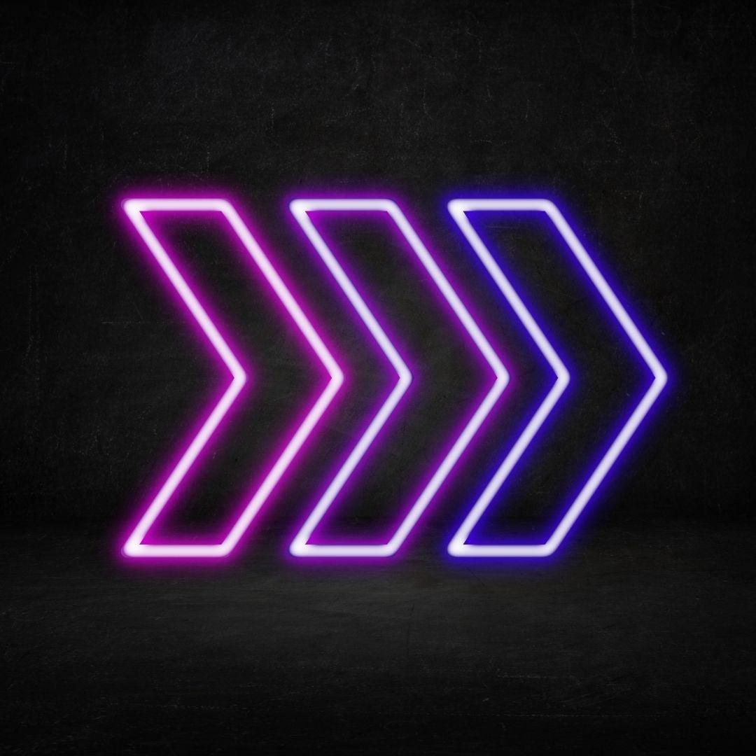 A custom neon light of three arrows in a row pointing to the right