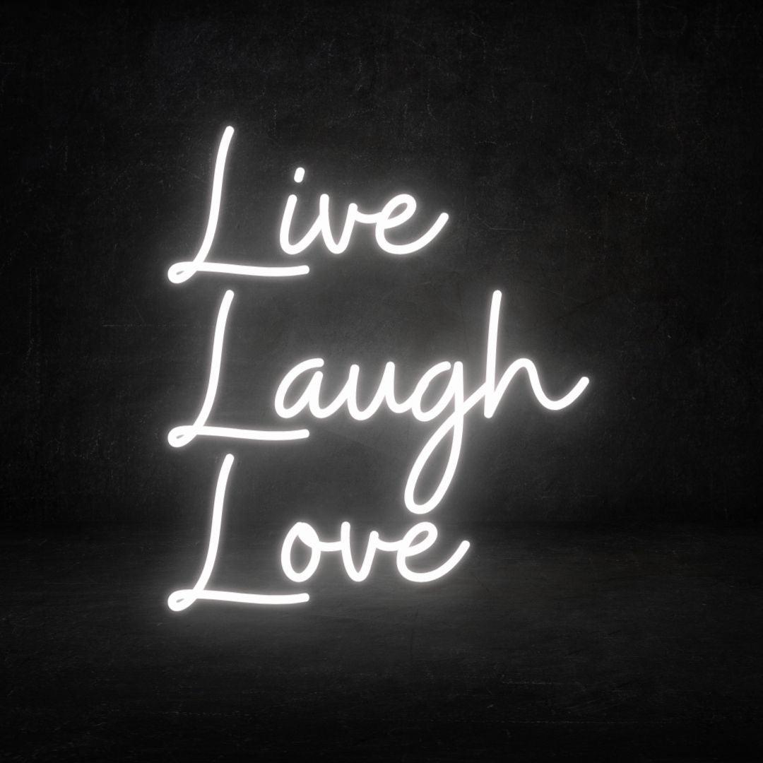 An image of a white custom neon sign with the text live, laugh, love