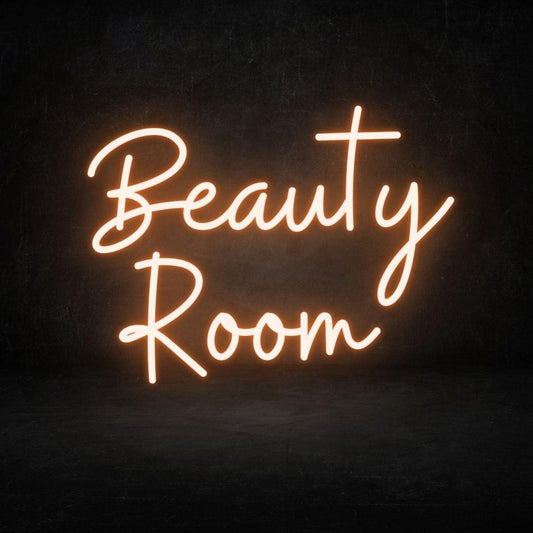 An image of a light orange custom neon sign with the text beauty room