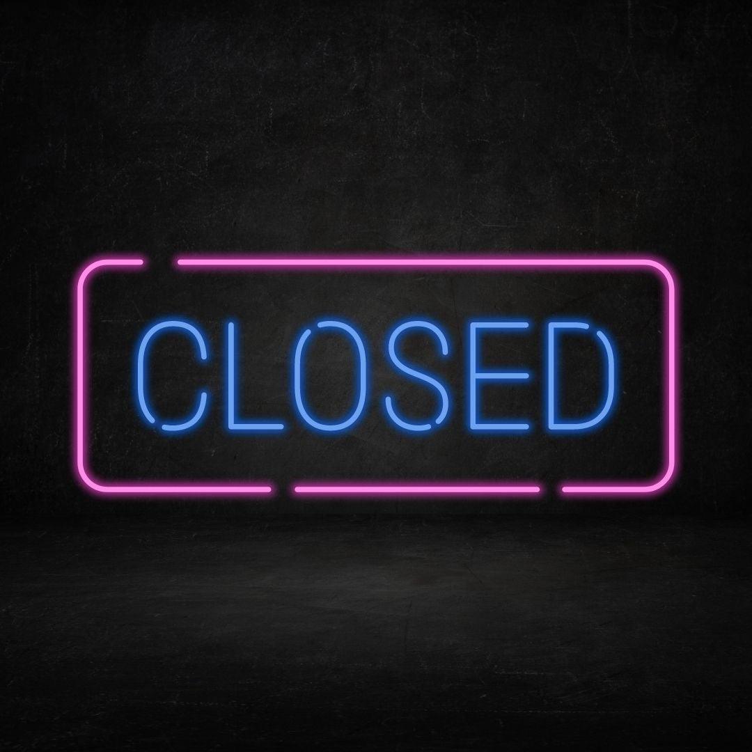 A custom neon light with the text closed