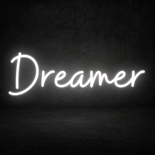 An image of a custom neon sign with the text dreamer