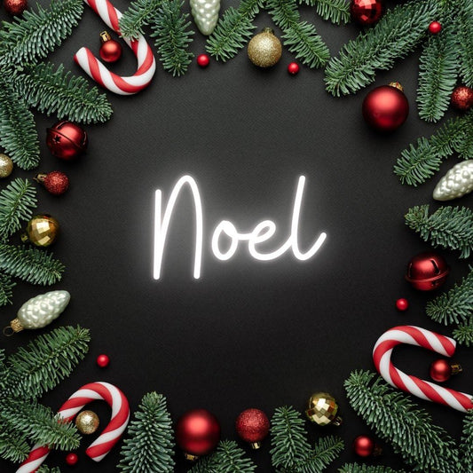 An image of a custom neon sign with the text noel