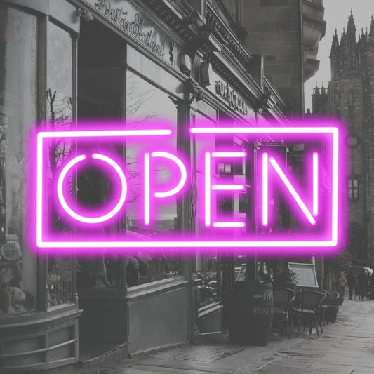 An image of a pink custom neon sign with the text open
