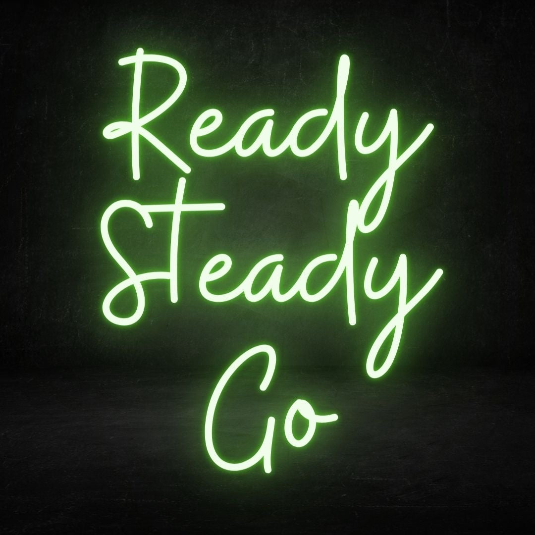 A custom neon light with the text ready steady go