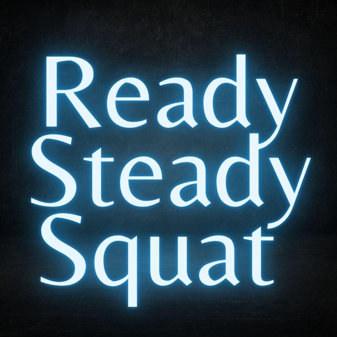 A blue custom neon light with the text ready steady squat