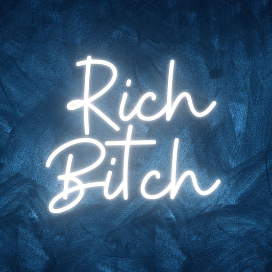 An image of a custom neon sign with the text rich bitch