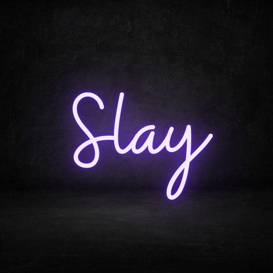 An image of a purple custom neon sign with the text slay